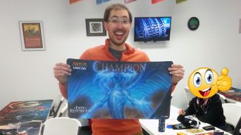 Patrick Merrill holding the Fate Reforged Game Day Playmat