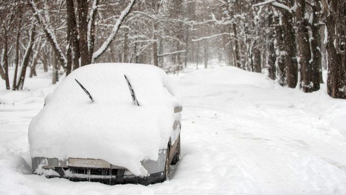Photo of car buried in snow